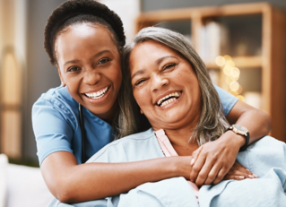 Senior care, hug and portrait of nurse with patient for medical help, healthcare or physiotherapy. Charity, volunteer caregiver and face of black woman at nursing home for disability rehabilitation